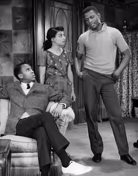 Photo of a scene from the play A Raisin in the Sun. From left-Louis Gossett (George Murchison), Ruby Dee (Ruth Younger) and Sidney Poitier (Walter Younger). Eve (1959)