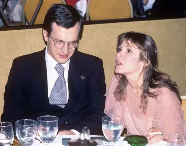 Carrie Fisher and Wim Wenders. Original text: Wim Wenders in 1978, here with Carrie Fisher - Photo taken at the private party after the premiere of the movie FI