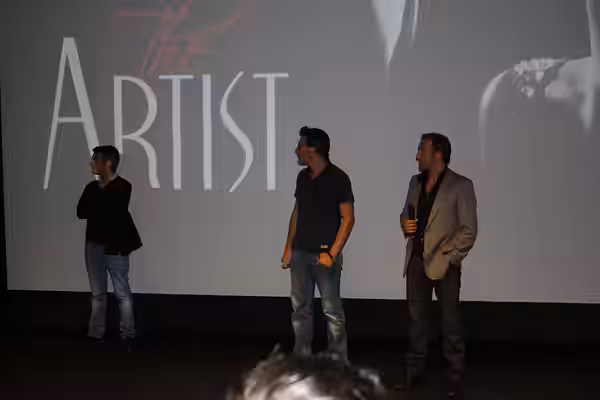 Thomas Langmann, Michel Hazanavicius, Jean Dujardin, lors d'une projection de The Artist. (2011)