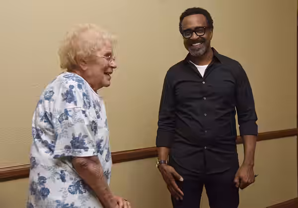 U.S. Air Force retired Col. Phyllis Luttman meets Tim Meadows, actor and comedian, following his performance at the Bay Breeze Event Center at Keesler Air Force (2018)