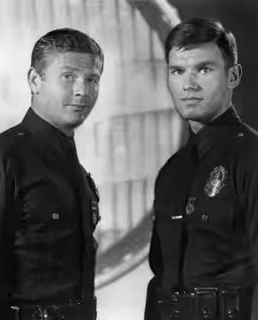 Photo of Martin Milner (left) as Malloy and Kent McCord as Reed from the television program Adam-12. The storyline was about two police officer partners-one a v