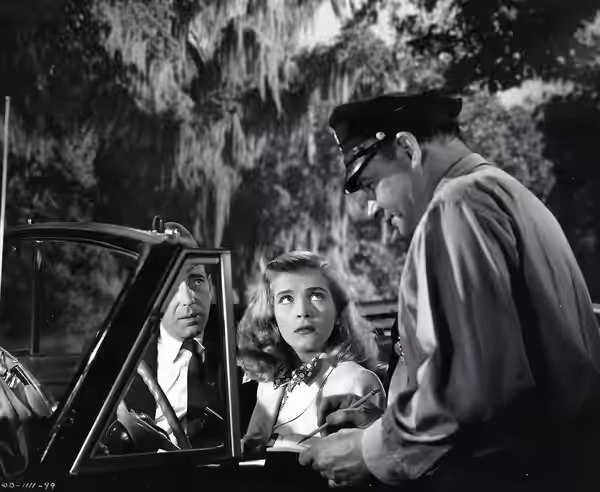 Humphrey Bogart and Lizabeth Scott in Dead Reckoning press photo. (1947)
