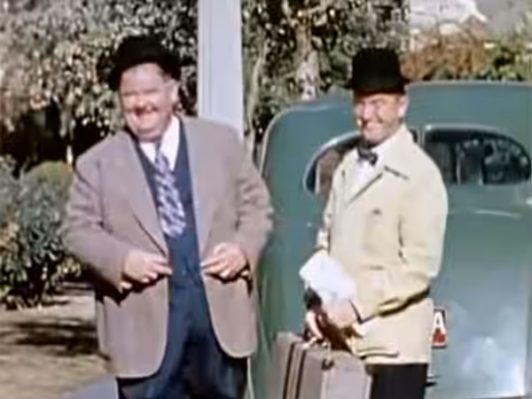Oliver Hardy and Stan Laurel in a still from the short film "The Tree in a Test Tube", time code: 00:29 (format: minutes:seconds) (1942)