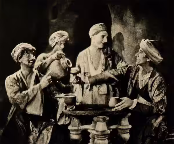 Still from the American drama film Omar the Tentmaker (1922) with Douglas Gerrard, Guy Bates Post, and Nigel De Brulier, on page 26 of the October 1922 Shadowla
