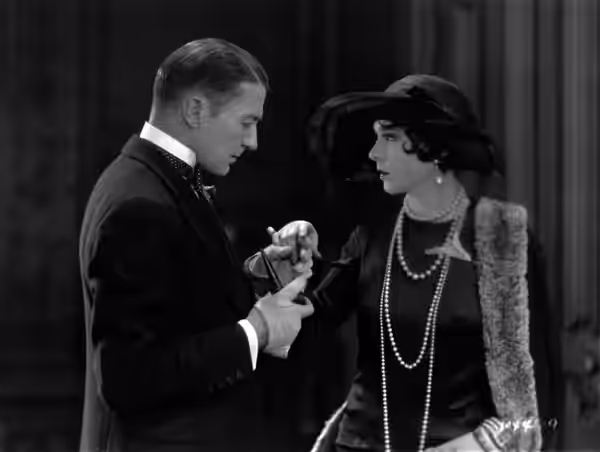 Clive Brook (left) and Florence Vidor in Afraid to Love (1927).