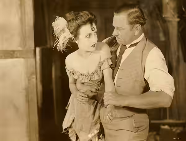Bessie Love and Wallace Beery in scene from the American film Dynamite Smith (1924).