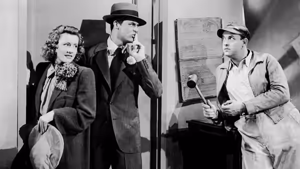Photo of Cary Grant, Irene Dunne and Edgar Buchanan from the 1941 film Penny Serenade. From the trade publication Film Bulletin. Note that the uploaded photo is