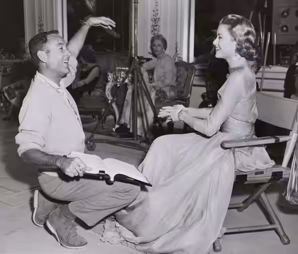 Director Charles Walters with Grace Kelly on the set of High Society (1956)