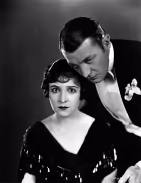Florence Vidor (left) and Clive Brook in Afraid to Love (1927).