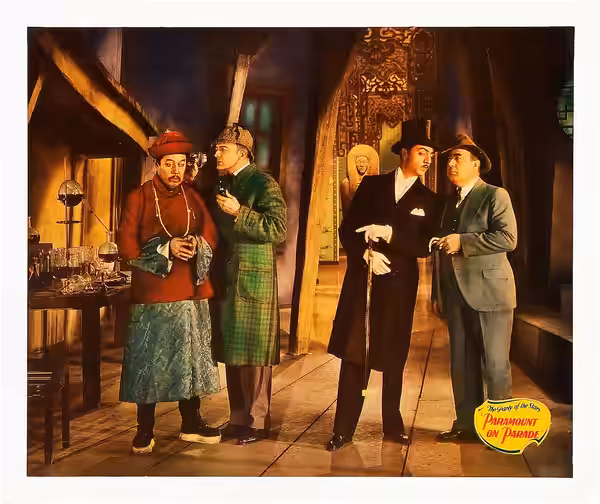 Jumbo lobby card for the 1930 film Paramount on Parade Image is a scene from the "Murder Will Out" skit, with Warner Oland (Fu Manchu), Clive Brook (Sherlock Ho