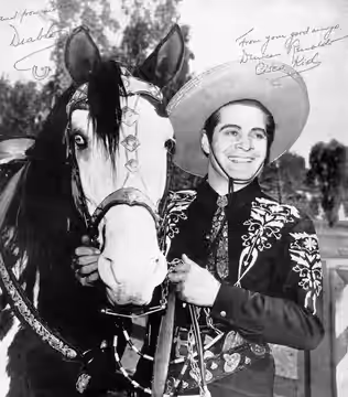 Black-and-white publicity photo of Duncan Renaldo (April 23, 1904–September 3, 1980) as The Cisco Kid and his horse, Diablo. This photo was distributed at perso (1953)