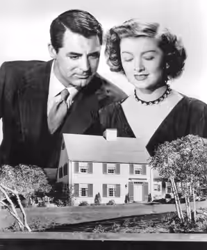 Promotional photo of Cary Grant and Myrna Loy for the film Mr. Blandings Builds His Dream House (1948). Loy is wearing a costume designed by costume designer Ro