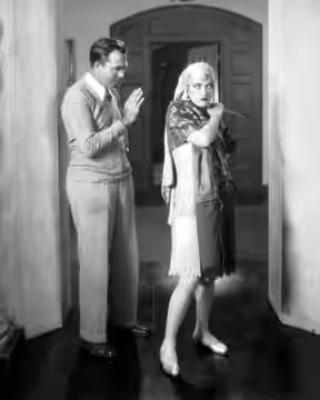 King Vidor (director) and actor Marion Davies on the set of The Patsy (1928 film). Davies imitating Gloria Swanson.