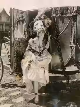 Silent film actress Violet De Barros in Orphans of the Storm (1921). From the back: "'Paris Was Just as Gay in the Olden Days' Our present day conception of 'ga (1922)