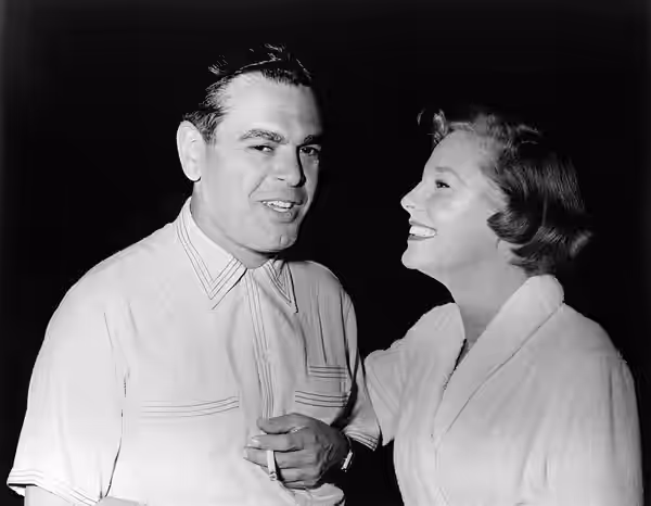 June Allyson, born Eleanor Geisman, smiles and jokes with the American producer Pandro Samuel Berman, on the set of the film Battle Circus. USA, 1953.