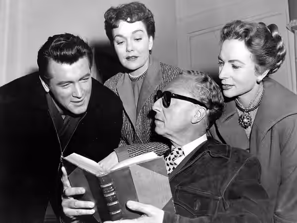 Publicity photo from the set of the 1955 film All That Heaven Allows. From left to right: actor Rock Hudson, actress Jane Wyman, director Douglas Sirk, and actr