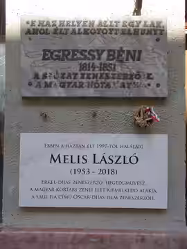 Four-storey corner building. Facade plaques: to Mr. Béni Egressy (1814–1851), Hungarian composer, librettist, translator and actor AND to Pál Rockenbauer travel
