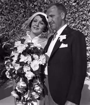 Actress Carmelita Geraghty and screenwriter Carey Wilson on their wedding day. The wedding took place in Beverly Hills and was a big, Hollywood event attracting (1934)