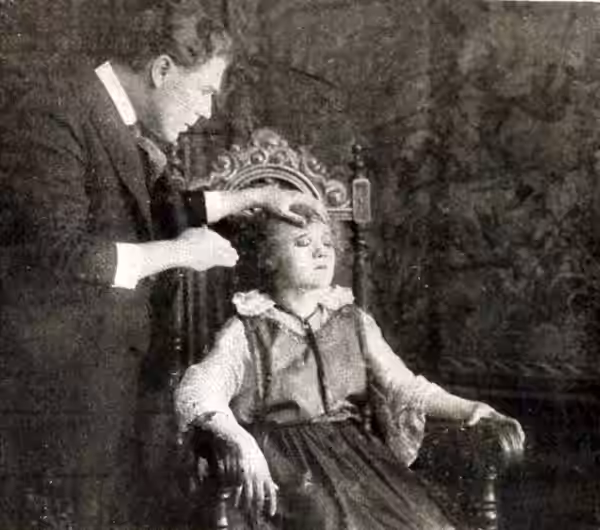 Psychical researcher Hereward Carrington in the American mystery film serial The Mysteries of Myra (1916). The film serial starred Jean Sothern as Myra. Illustr