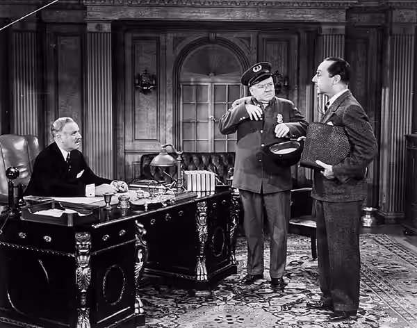 Promotional photo of W. C. Fields and two co-stars in the 1940 film The Bank Dick.