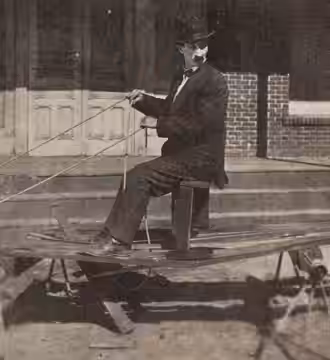Still from the American comedy short film All Wrong (1921) with Clyde Cook and his specially constructed vehicle, on page 99 of the February 5, 1921 Exhibitors