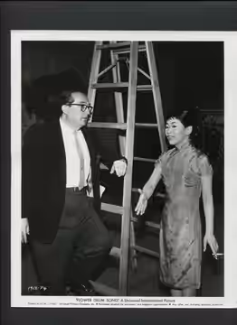 Press photo of Henry Koster and Miyoshi Umeki for the 1961 film Flower Drum Song