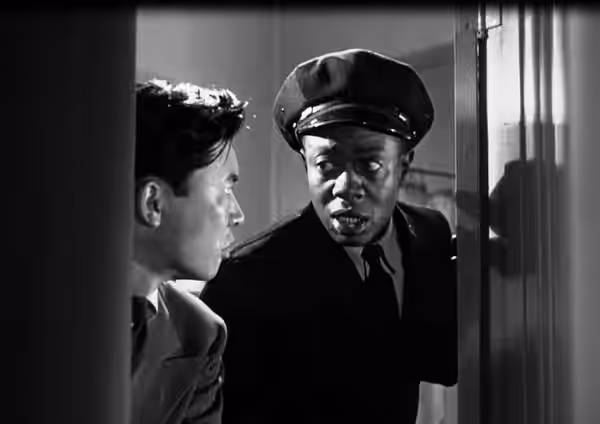 Low resolution screenshot of Victor Sen Yung as Jimmy Chan and Willie Best as Chattanooga Brown from the American film Dangerous Money (1946). The film is in th