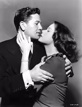 Promo photo of John Garfield and Beatrice Pearson in the 1948 film Force of Evil.