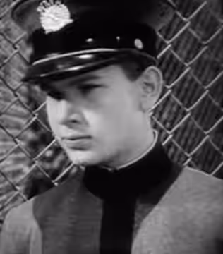 Trailer screenshot of actor Frankie Thomas in On Dress Parade. (1939)