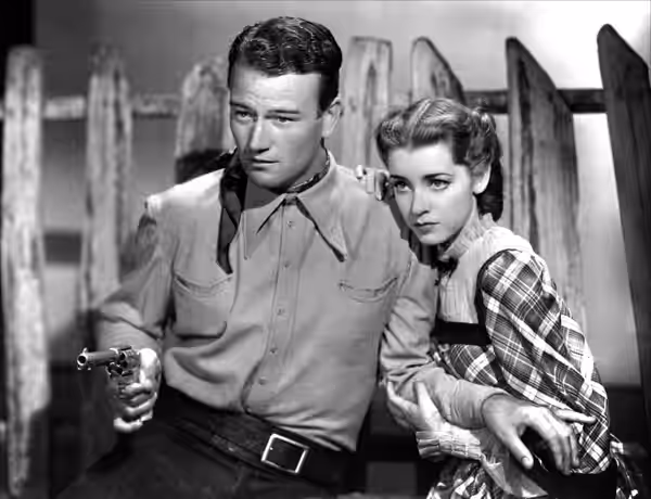 John Wayne &amp; Marsha Hunt in Born to the West aka Hell Town - cropped screenshot (1937)