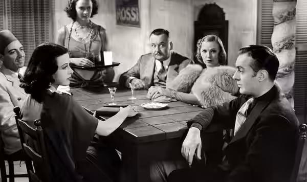 L. to R. (seated): Joseph Calleia, Hedy Lamarr, Bert Roach, Claudia Dell &amp; Charles Boyer in Algiers - publicity still (cropped) (1938)