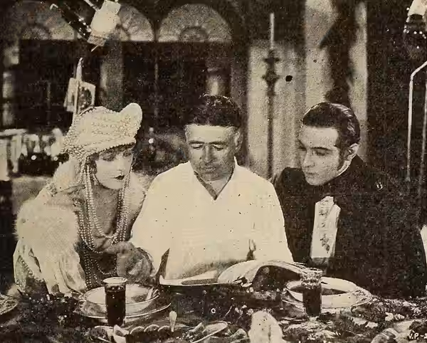 Clarence Brown with Vilma Banky, and Rudolph Valentino on the set of The Eagle (1925), Exhibitor's Trade Review