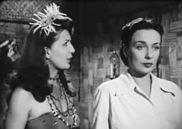Low resolution screenshot of Amira Moustafa as Zita, the Amazon Queen, and Patricia Morison as Jean Preston in the American public domain film Queen of the Amaz (1947)