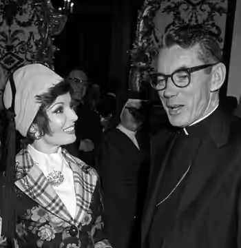 Actress Ann Blyth talking with Cardinal Timothy Manning at Ladies of Charity luncheon in Los Angeles (1973)