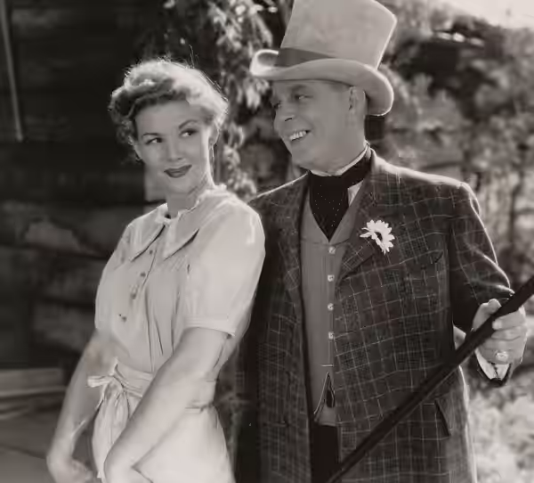 Veda Ann Borg and Hoot Gibson in Marked Trails - publicity still (original image damaged, modified and cropped : see source) (1944)