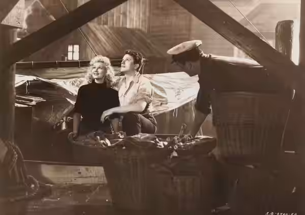Virginia Mayo and Michael O'Shea in Jack London (1943) - cropped screenshot.