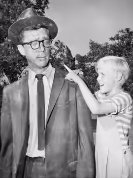 Photo of Herb Anderson as Henry Mitchell and Jay North as his son, Dennis, from the television program Dennis The Menace. (1959)