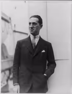 Title: George Gershwin, 1898-1937, half-length portrait, standing, facing left Abstract/medium: 1 photographic print.