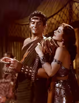 Color photograph of Victor Mature and Hedy Lamarr as Samson and Delilah (1949).