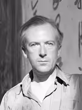 Cecil Beaton Photographs- GeneralCecil Beaton self portraits: Cecil Beaton (in shorts and shirt) with wicker baskets beside a wall with Chinese characters in Pu