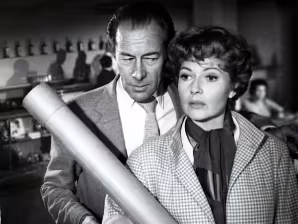Rex Harrison and Rita Hayworth in the American crime/comedy-drama film The Happy Thieves (1961).