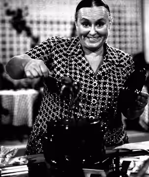 Italian actress Ave Ninchi cooking.