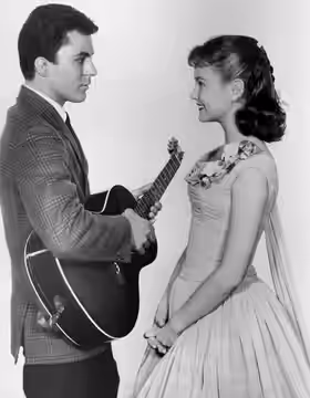 Photo of guest star James Darren as Buzz Berry and Shelley Fabares as Mary Stone from the television program The Donna Reed Show. (1959)