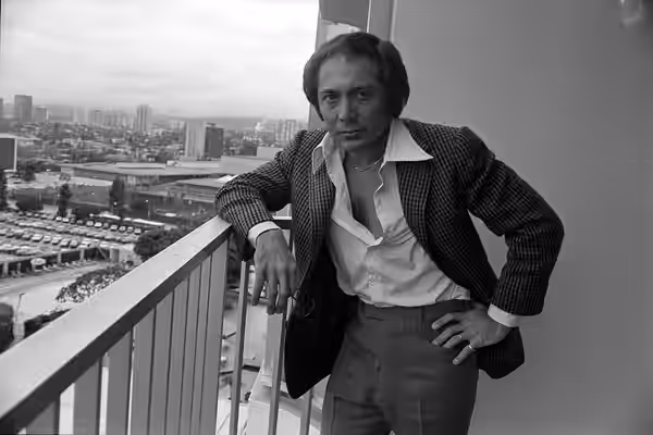 Singer Paul Anka standing on balcony in Los Angeles. Original caption: "HIS WAY—Pop music star Paul Anka doesn't claim his compositions are masterpieces, but th (1975)