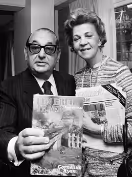 Film producer Joseph E. Levine and Kathryn Ryan (widow of author Cornelius Ryan) at a press conference for the film "A Bridge Too Far" (1975)