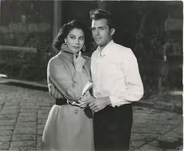 Ava Gardner and Dirk Bogarde in a scene from The Angel Wore Red (Italian title: La sposa bella), a 1960 film directed by Nunnally Johnson.