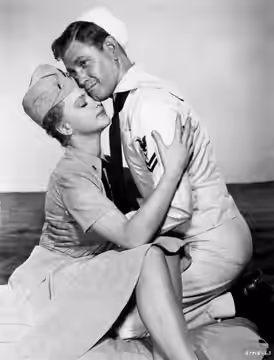 Publicity photo of Anne Francis and Earl Holliman for Don't Go Near The Water (1957)