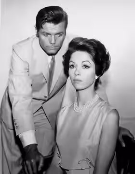 Photo of Jack Lord and Dana Wynter from the television program Bob Hope Presents the Chrysler Theatre. (1965)