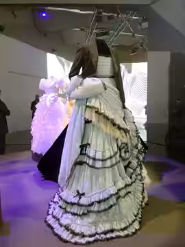Gucci dress worn by Styles on the cover of Vogue on display at the Victoria and Albert Museum (2022)