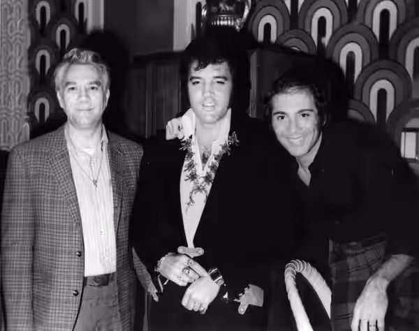 Photo of Elvis Presley with close friends and collaborators Bill Porter and Paul Anka. The photo was taken on August 5, 1972 at the Las Vegas Hilton. Bill Porte
